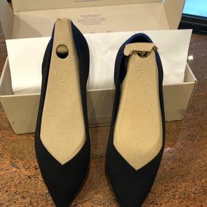 Roth’s size 12 black point flats